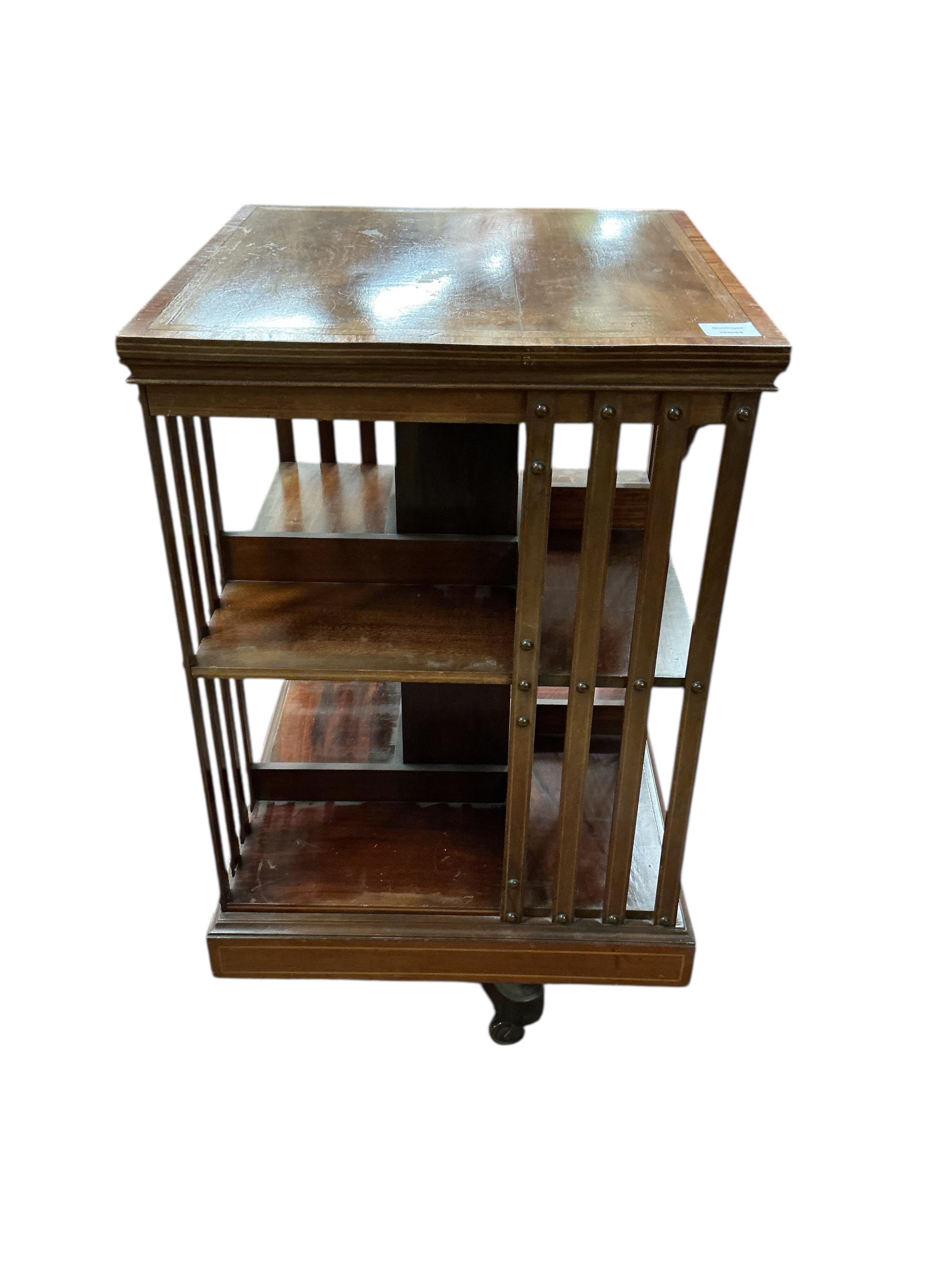 An Edwardian inlaid mahogany revolving bookcase, width 49cm, depth 49cm, height 86cm